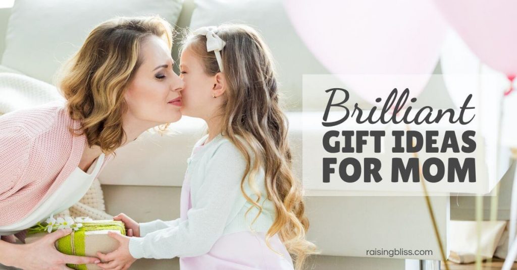 Girl kisses her mom and gives her a gift box