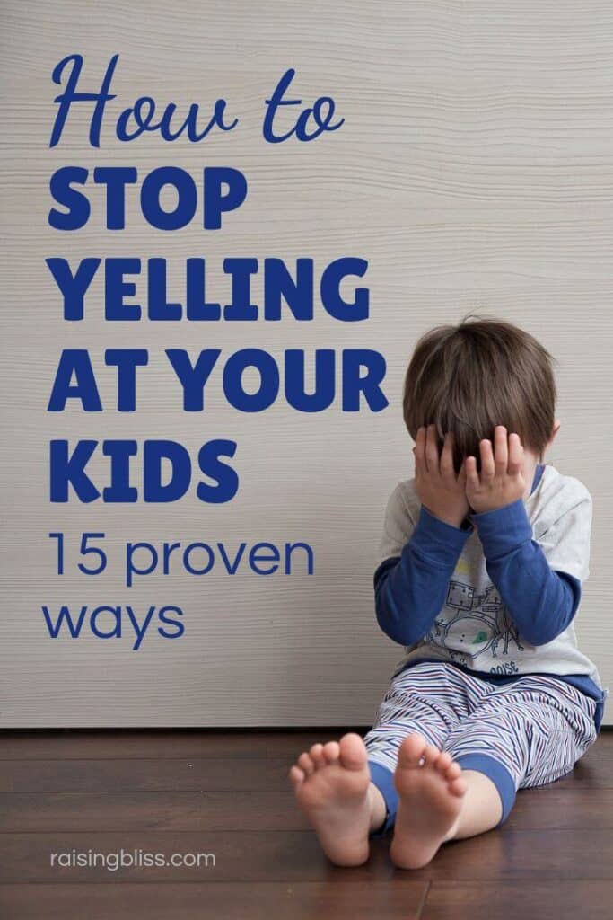 An upset little boy sitting on the floor, covering his face