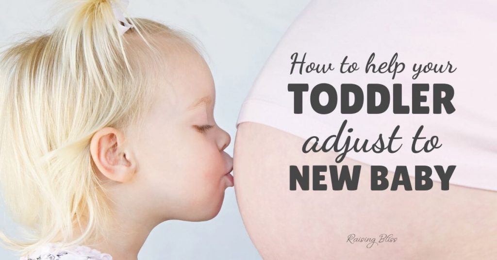 Little girl kissing mommy's belly - How to help your toddler adjust to new baby by Raising Bliss